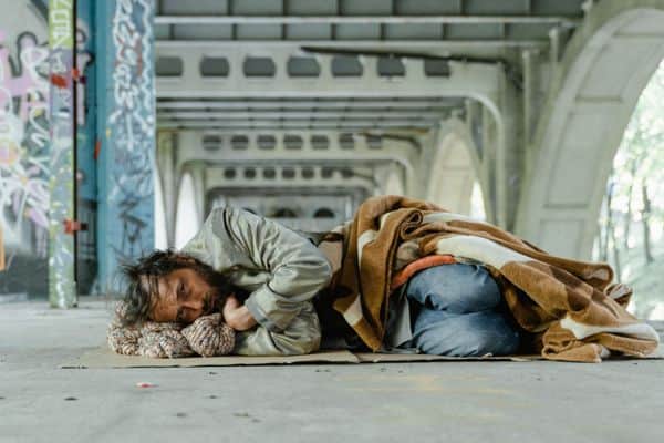 The Rich Man and Lazarus Parable Life Lessons - homeless man lying in street