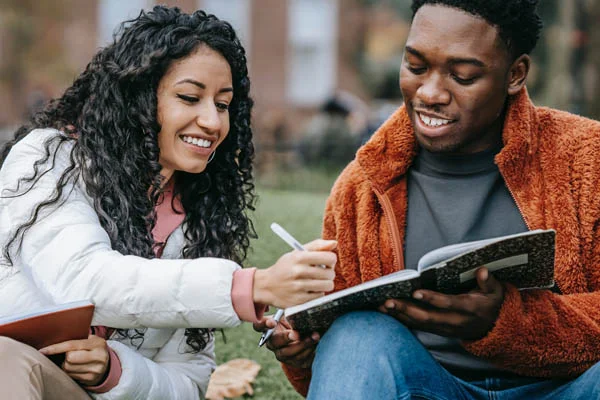 Best Devotionals for 20 Somethings - college students working together